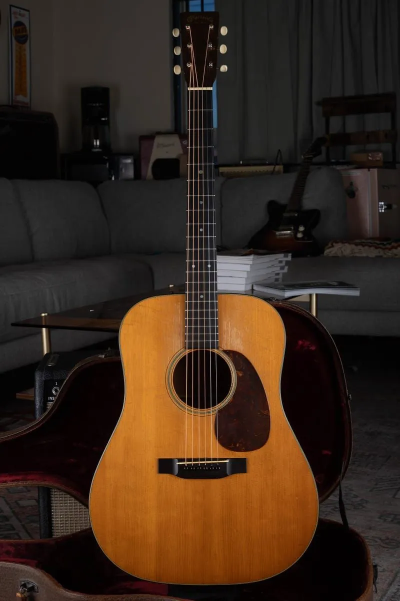 Joe Dampt holding a 1945 Martin D-18 purchased by Joe's Vintage Guitars