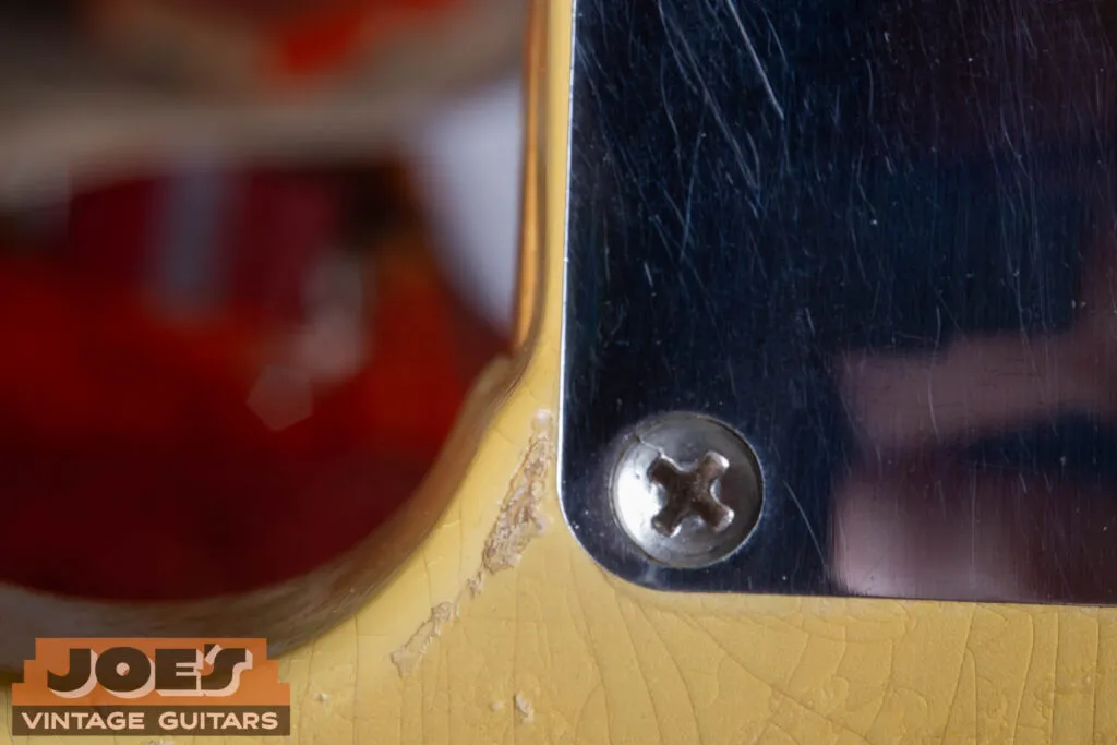 Close-up of a 1952 Fender Telecaster neck cutaway showing the authentic “router hump” in the wood.