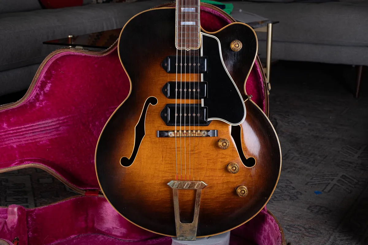 Front of a 1953 Gibson ES-5 in sunburst with three dog-ear P-90 pickups and its original finish, resting in its pink-lined case. We buy vintage Gibson archtops nationwide at Joe's Vintage Guitars.