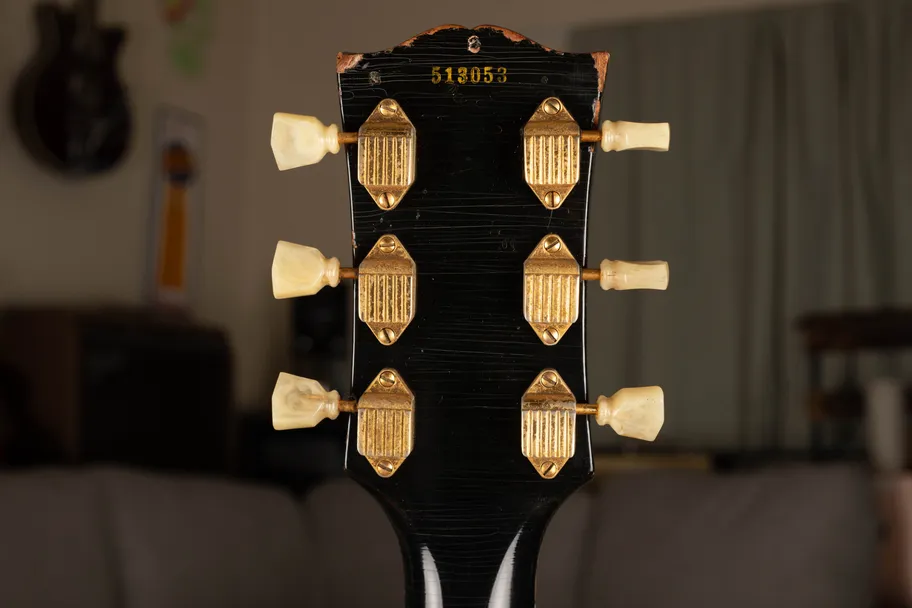 Ink-stamped serial number on the back of the headstock of a 1955 Gibson Les Paul Custom, the method Gibson used to serialize solid body electric guitars from 1952 through 1960