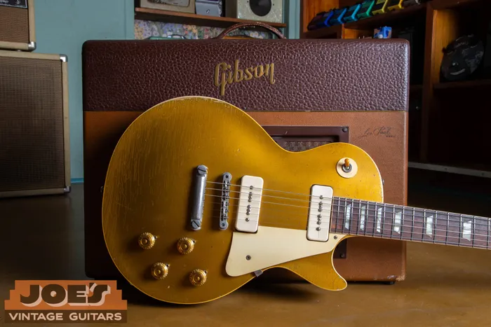 1956 Gibson Les Paul Goldtop with P-90 pickups and no-wire ABR-1 bridge leaning against a vintage 1950s Gibson Les Paul GA-40 amplifier.