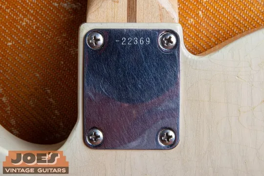 1957 Fender Esquire blonde neck plate showing the serial number stamped at the top edge