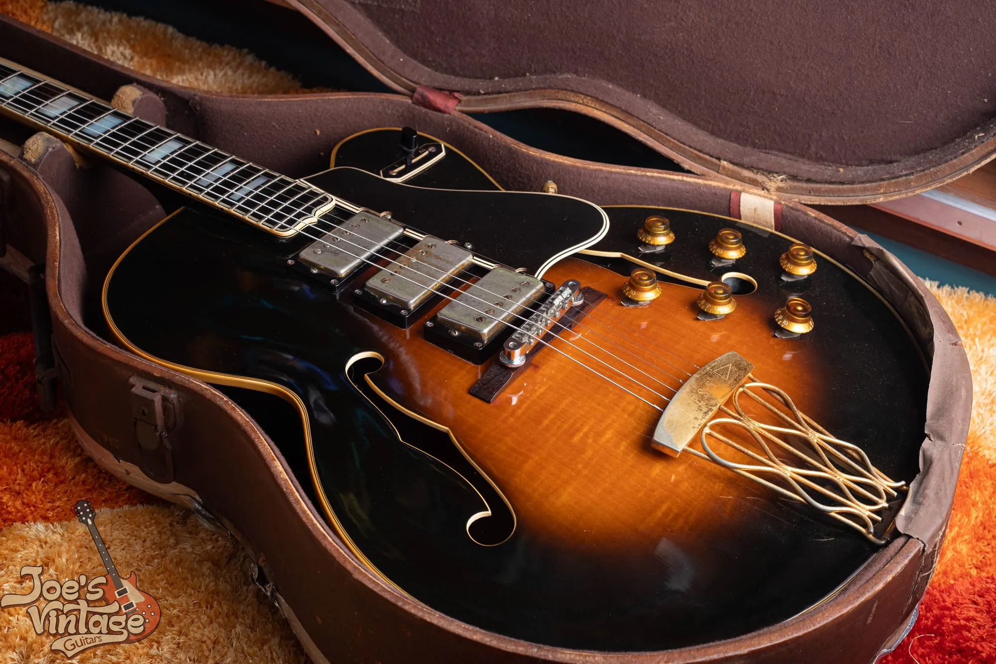 Three humbucker pickups and six gold knobs on a 1958 Gibson ES-5 Switchmaster in sunburst.