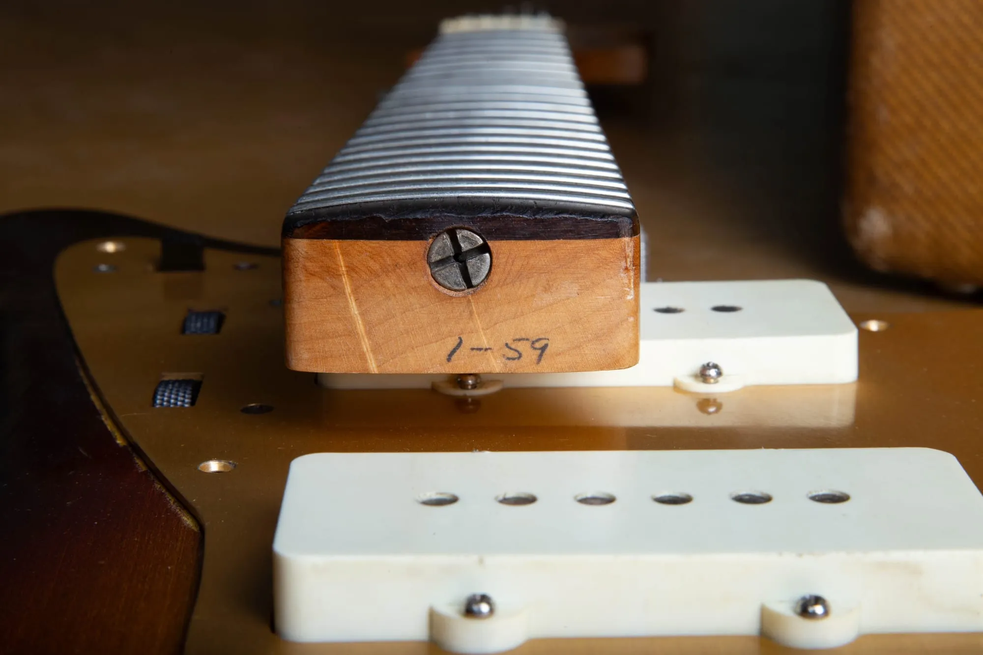 1959 Fender Jazzmaster neck heel with the pencil date 1-59 handwritten on the butt end, confirming January 1959 production of a gold guard example