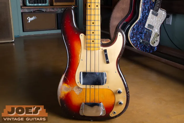 A 1959 Fender gold guard precision bass in Sunburst finish.