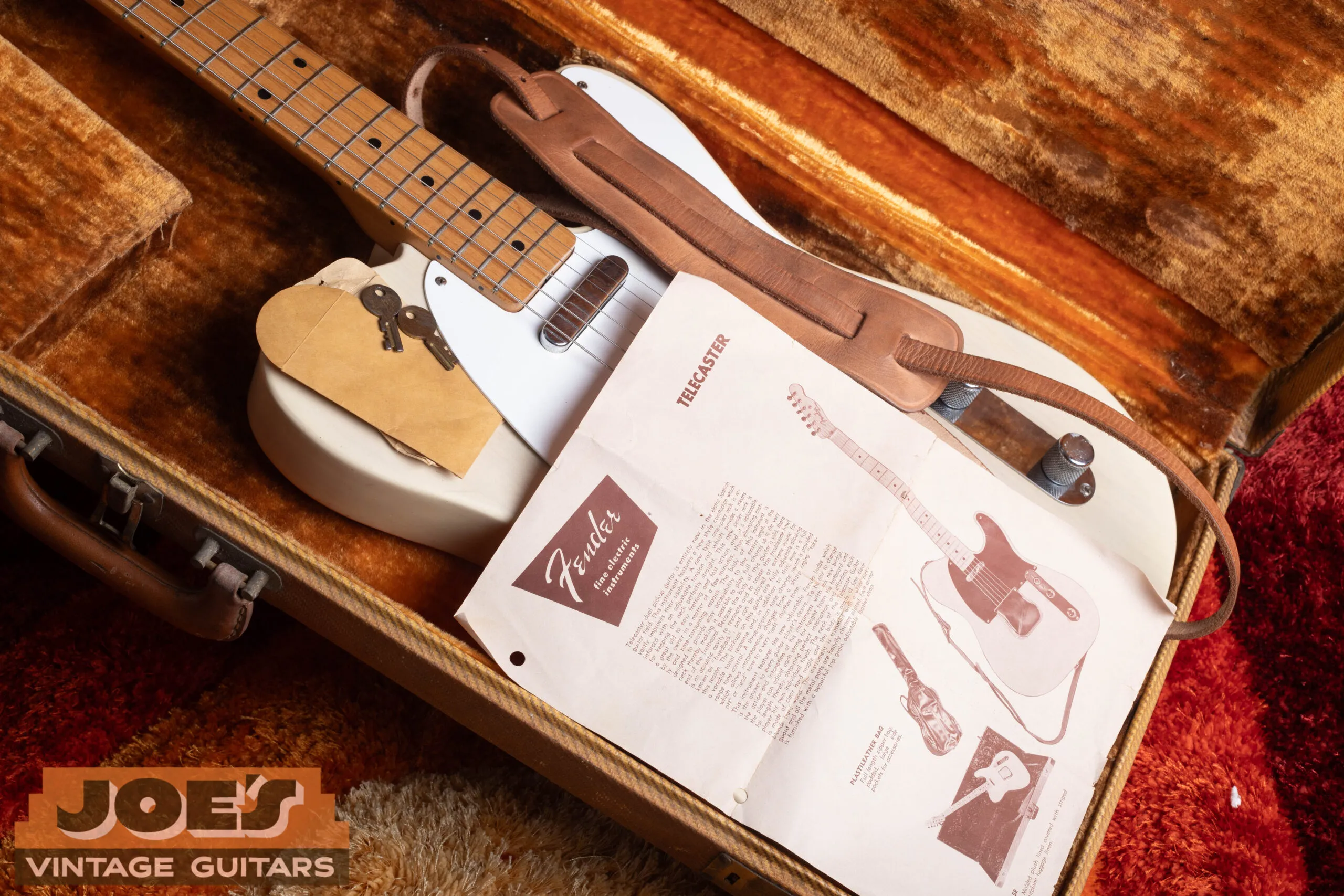 1959 Fender Telecaster original case candy including strap, case key, and paperwork, rare surviving accessories that confirm original ownership history