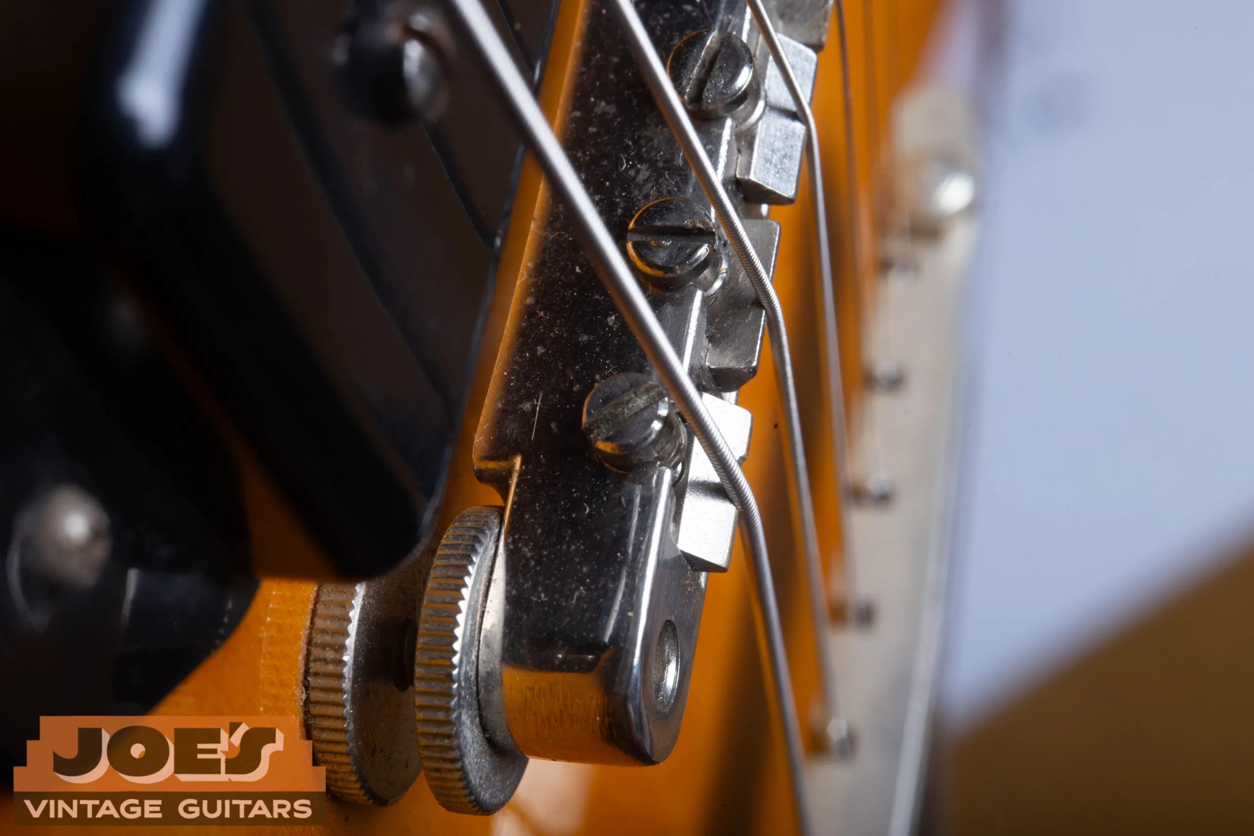 Macro of 1959 ABR-1 Tune-o-matic bridge on Gibson ES-330, no retaining wire on the saddles