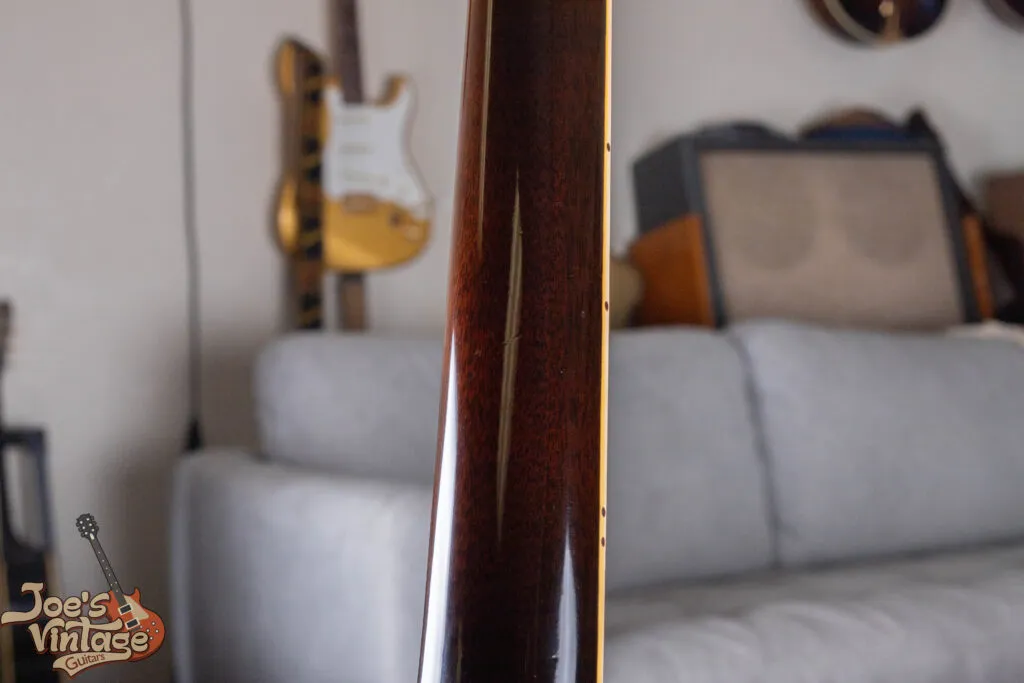 Original sunburst finish on the back of a 1959 Gibson ES-335 neck showing minimal play wear and period-correct nitrocellulose lacquer.