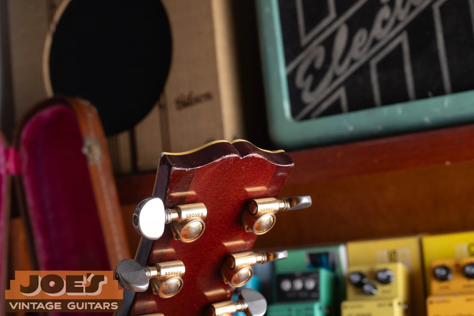 Gold Grover Rotomatic tuners with the Grover name stamped across the housings on the back of a 1959 Gibson ES-355 headstock, gold plating worn.