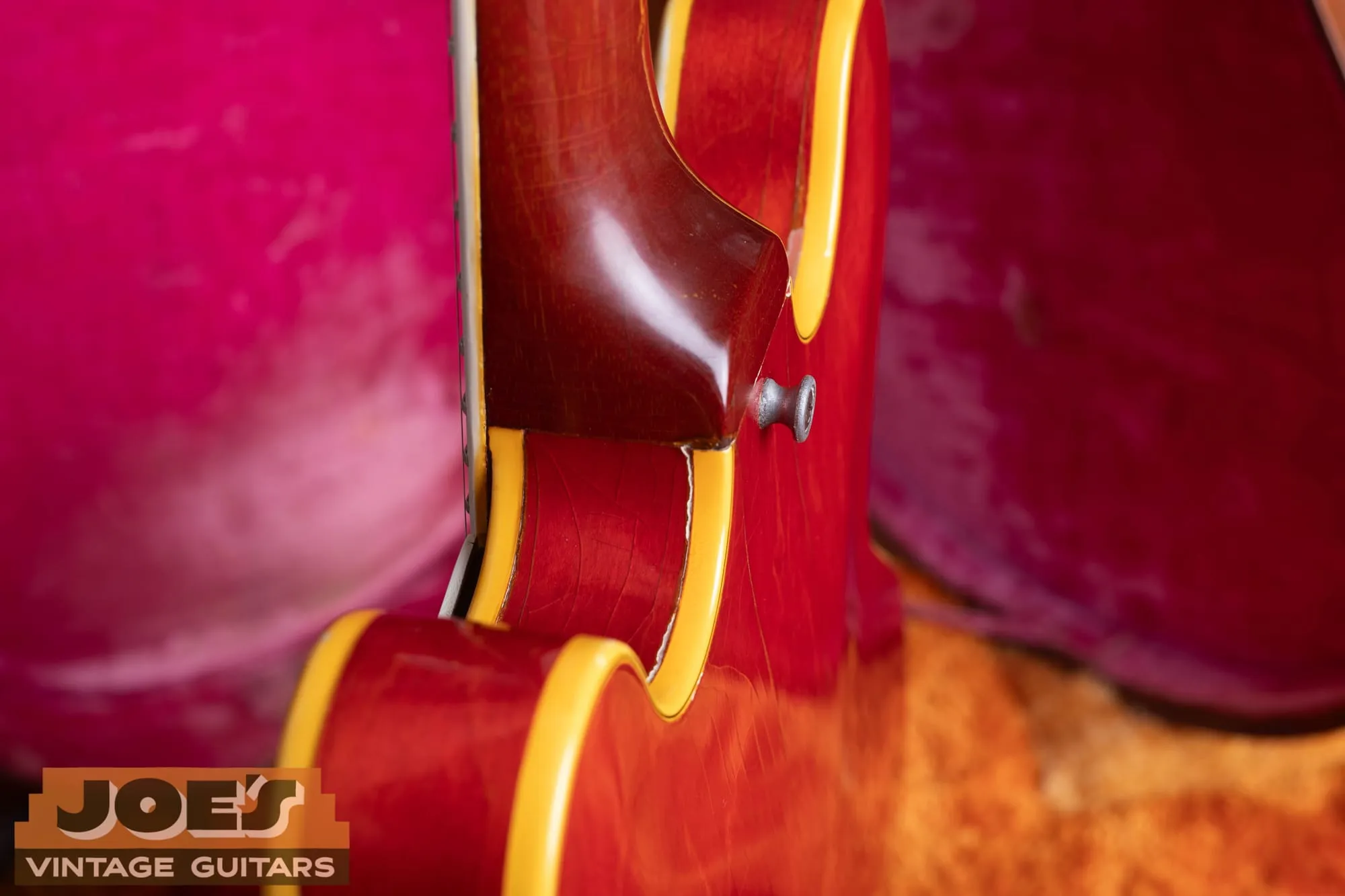 Multi-ply cream and black body binding on the cutaway of a 1959 Gibson ES-355 in cherry, next to a bound f-hole.