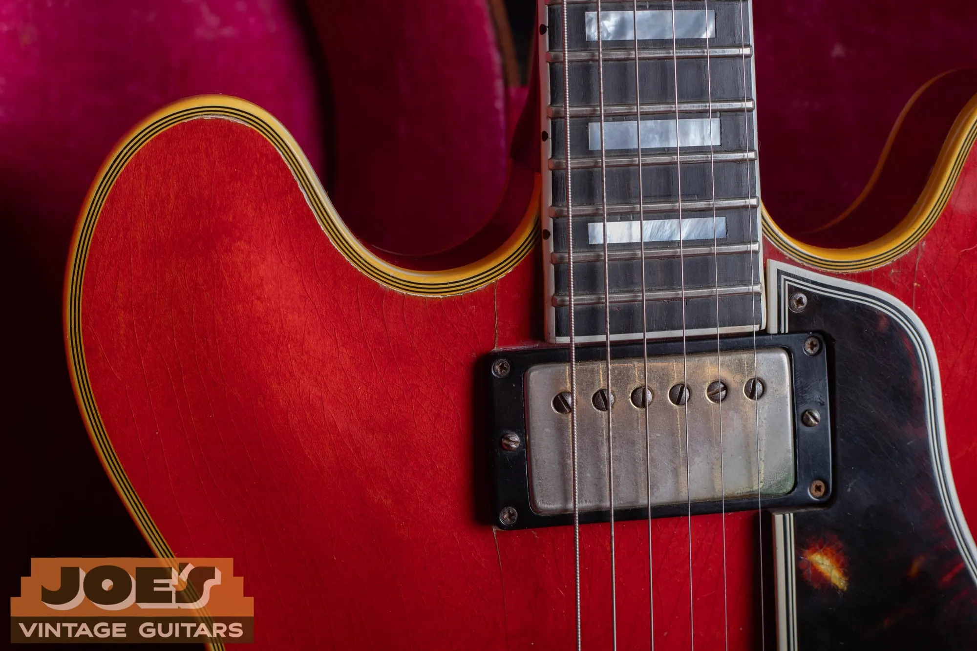 Ebony fingerboard with pearl block inlays and multi-ply binding on the neck of a 1959 Gibson ES-355 in cherry.
