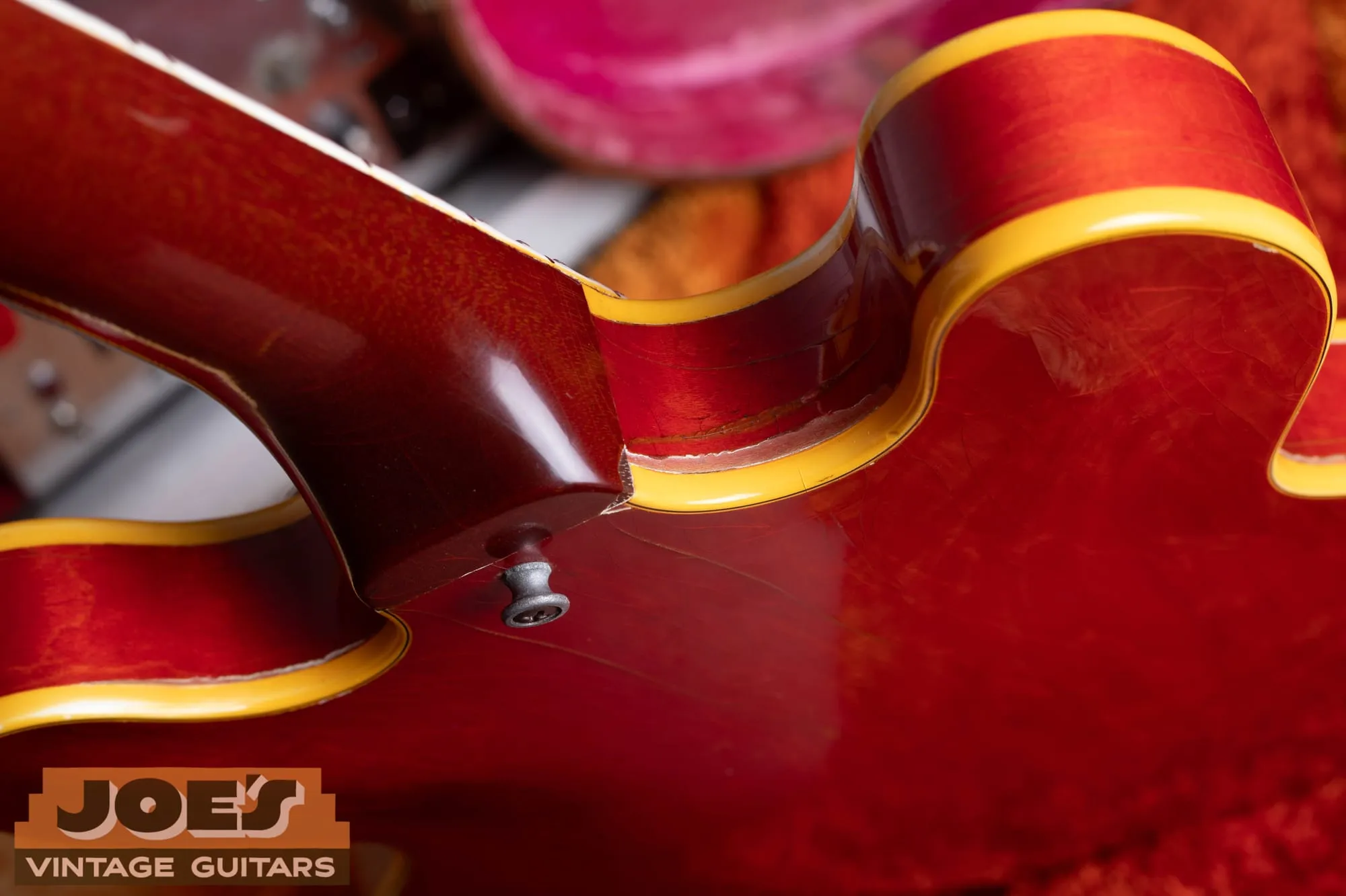Neck heel and multi-ply binding at the body joint of a 1959 Gibson ES-355 in cherry.
