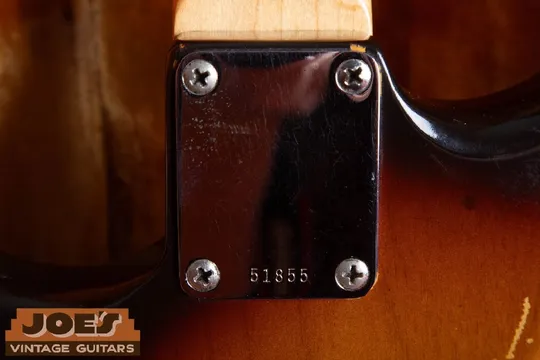 1960 Fender Stratocaster neck plate with the serial number stamped along the bottom edge