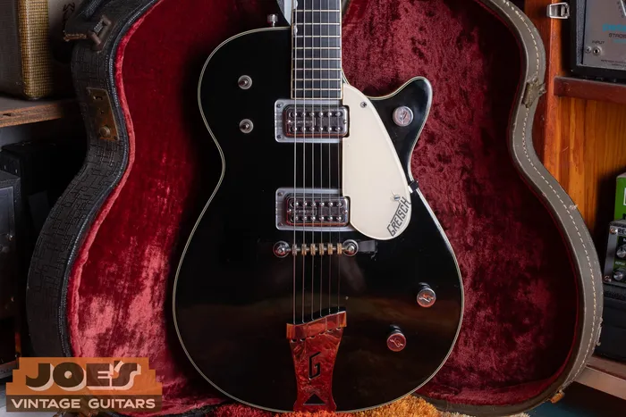 Front of a black single-cutaway Gretsch Duo Jet 6128 with two Filter'Tron pickups in its original red-lined hardshell case. We buy vintage Gretsch guitars nationwide at Joe's Vintage Guitars.