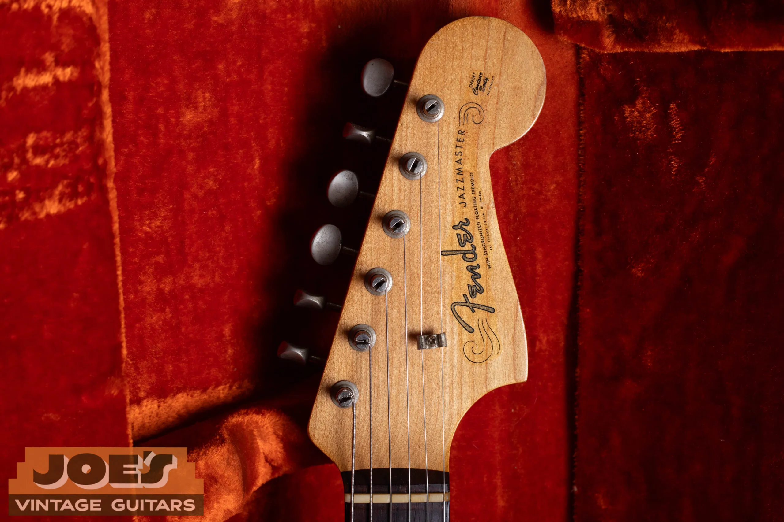 1960s Fender Jazzmaster headstock with spaghetti logo, pre-CBS thin flowing cursive Fender script in gold, clay dot fingerboard, single-line Kluson tuners