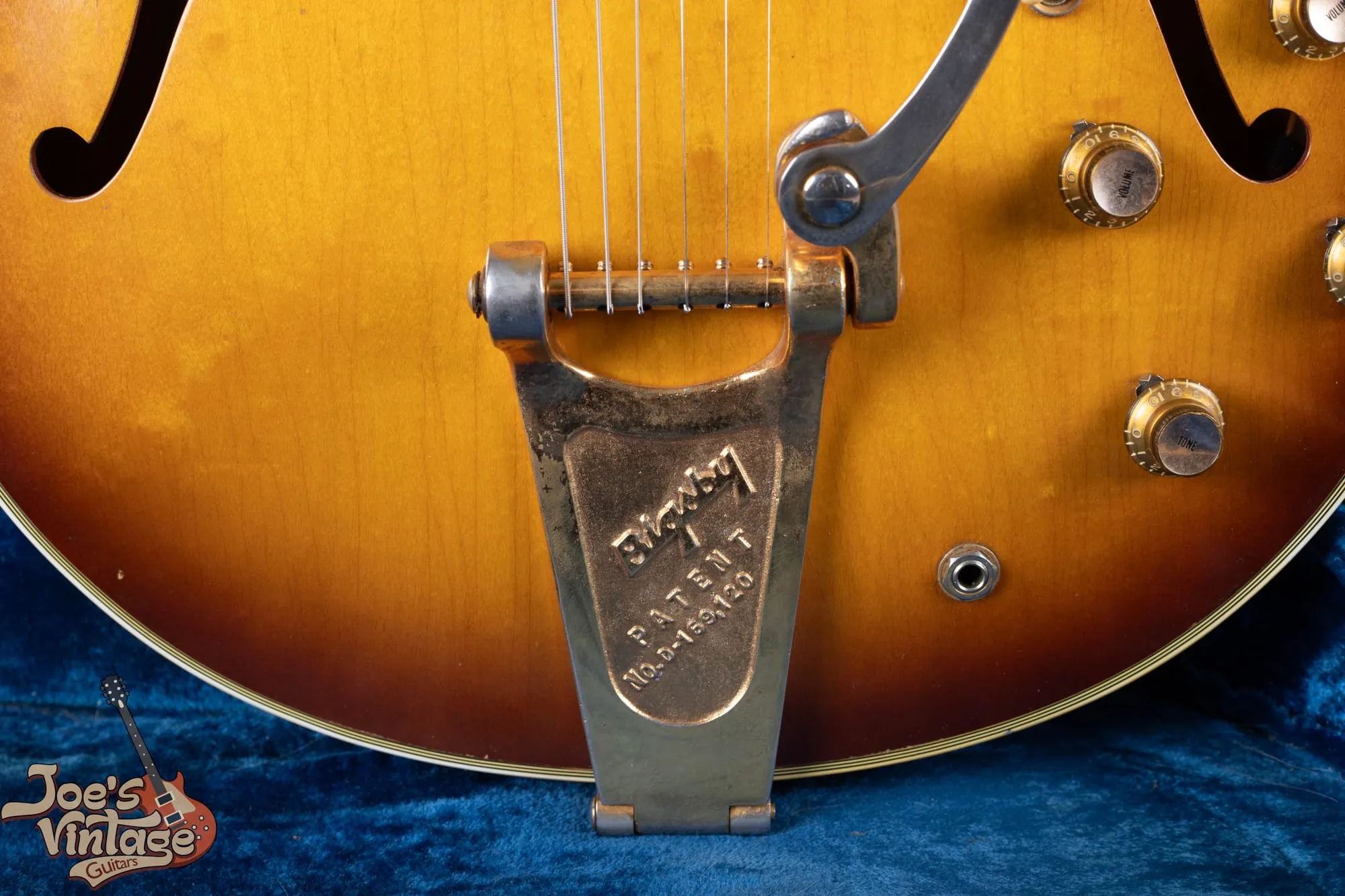 Bigsby vibrato tailpiece on a vintage Epiphone Sheraton, engraved Bigsby Patent, with a tune-o-matic bridge above it.
