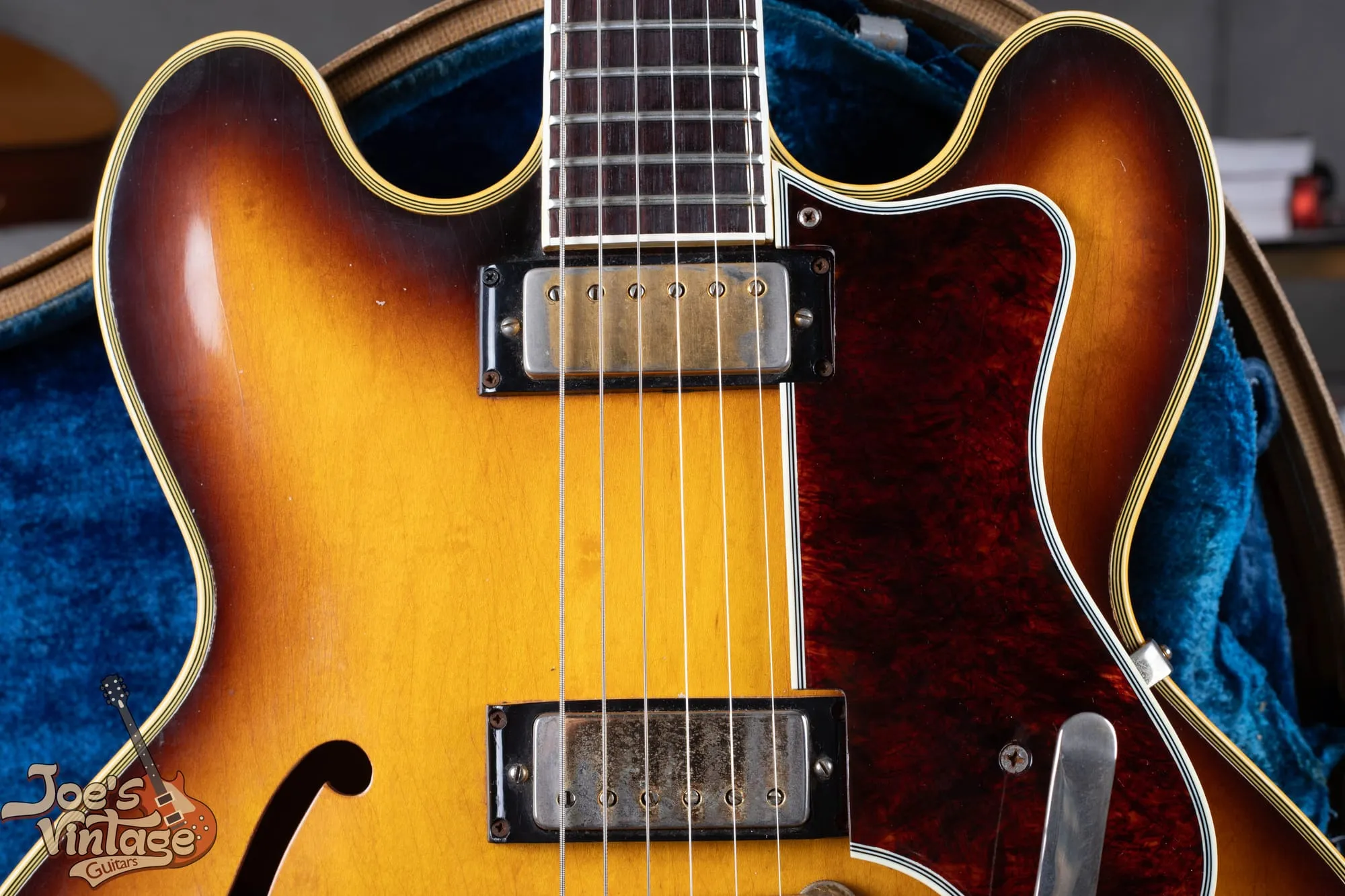 Two mini-humbucker pickups on a 1961 Epiphone Sheraton, with block inlays and multi-ply binding visible.