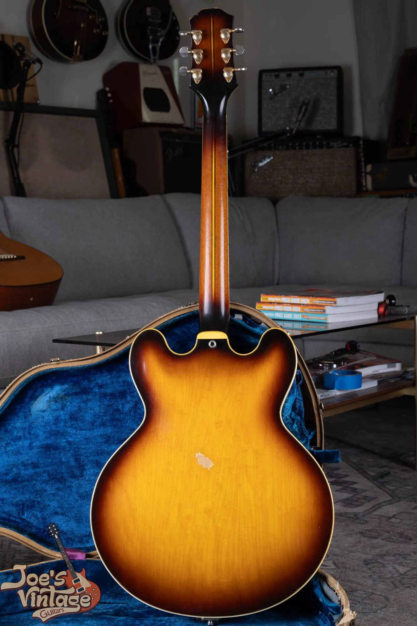 Full back of a 1961 Epiphone Sheraton in sunburst showing the laminated maple back and set neck.
