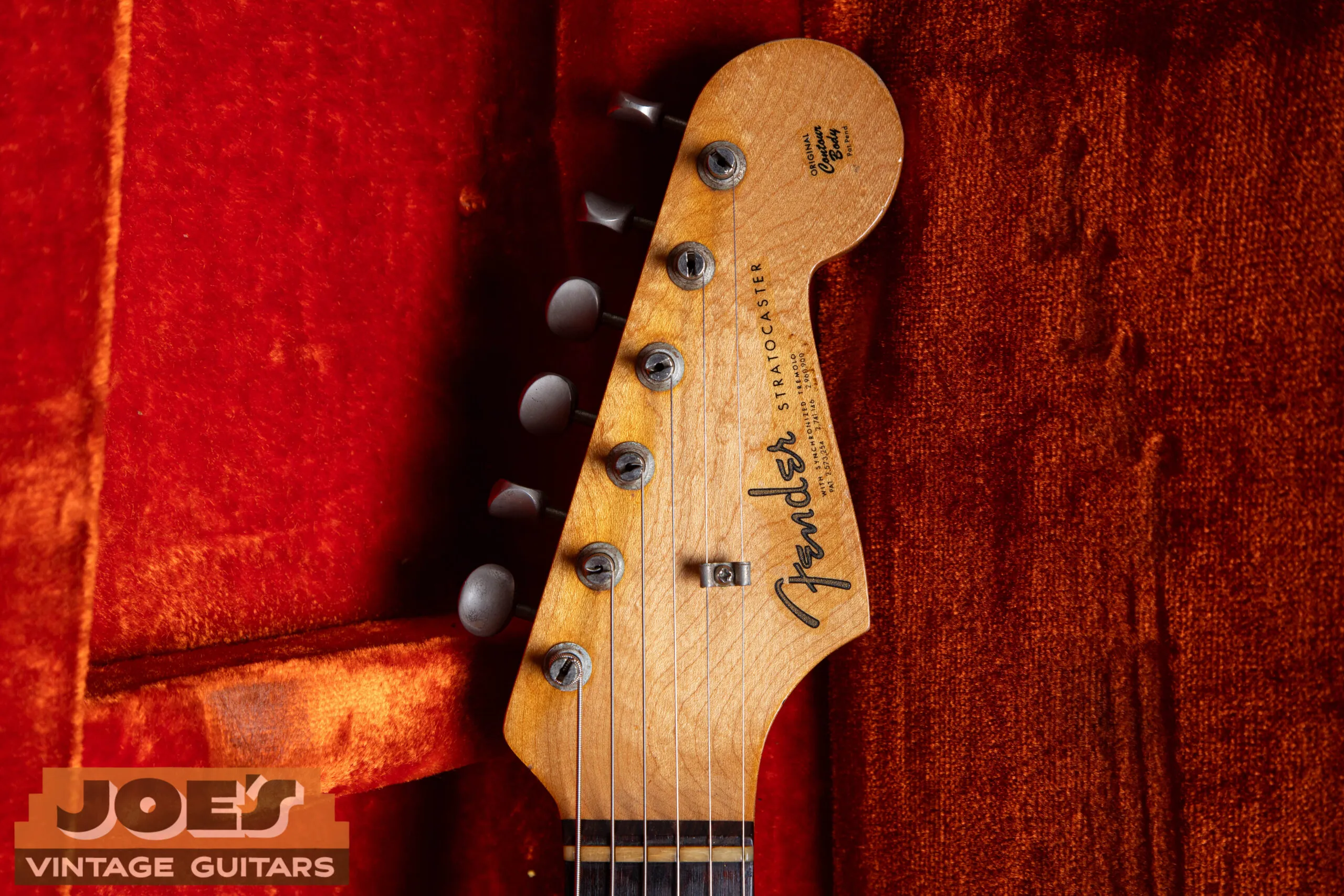 1962 Fender Stratocaster headstock showing the gold spaghetti logo with three patent numbers, Kluson Deluxe tuners, and butterfly string tree, pre-CBS Fullerton
