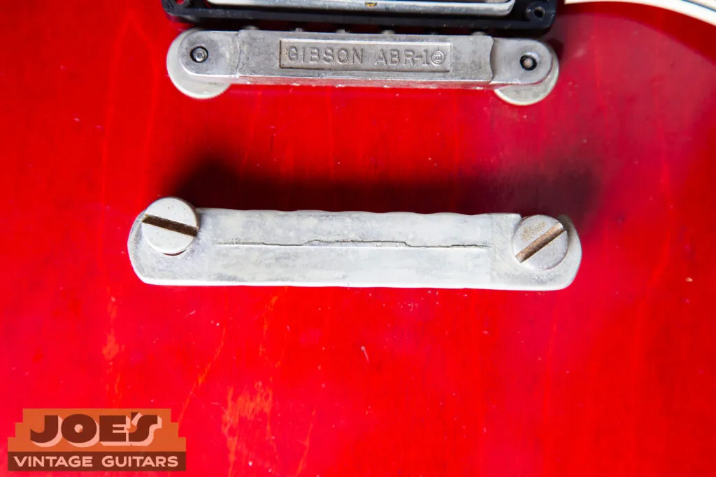 Forensic view of a 1962 Gibson ES-335 hardware set featuring a nickel-plated ‘no-wire’ ABR-1 bridge and the back of a lightweight stop tailpiece with the original short seam.