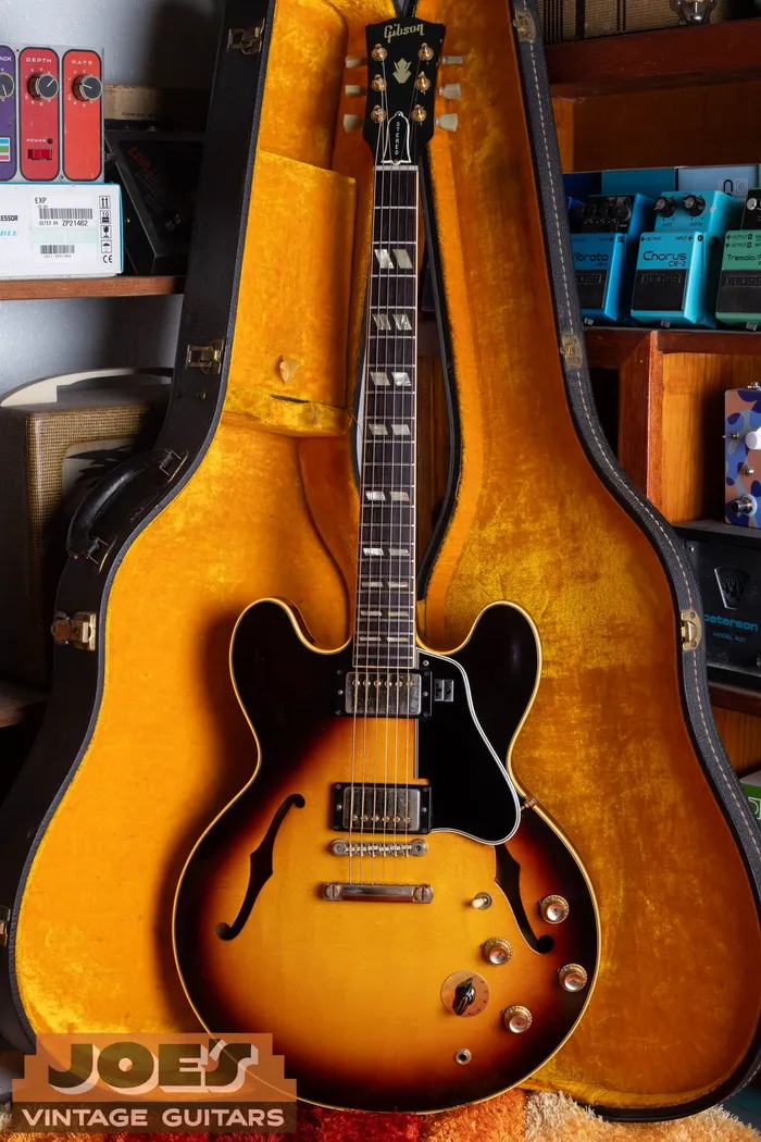 A 1963 Gibson ES-345TD in sunburst standing in its case at Joe's Vintage Guitars, showing the gold hardware and stereo Varitone controls.
