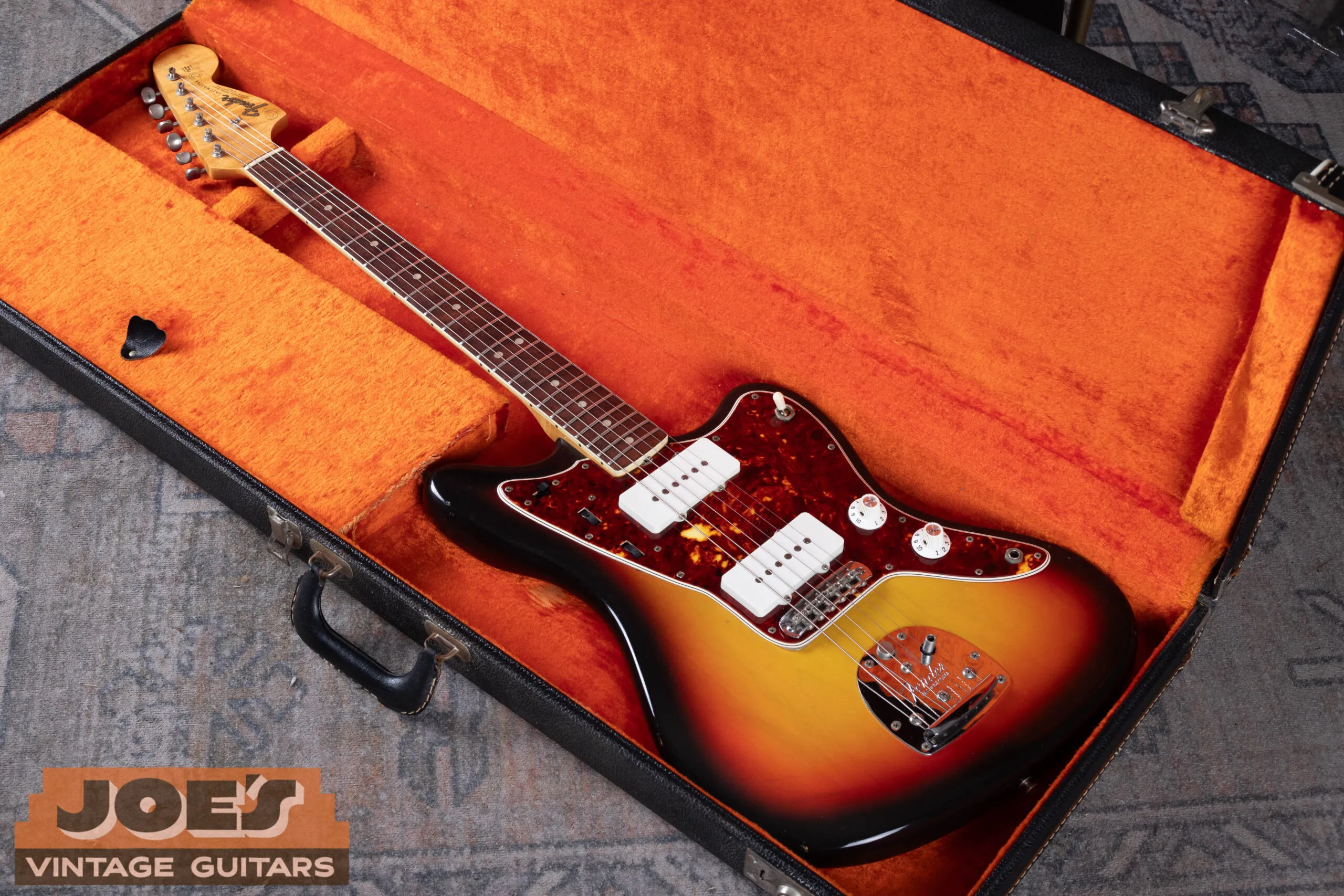 1966 Fender Jazzmaster in original black Tolex hardshell case with orange interior, CBS-era case correct for mid-1960s Fender production