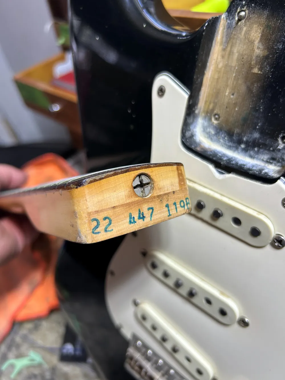 A green ink neck stamp reading 22 447 1198 on a 1969 Fender Stratocaster neck heel