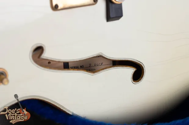 Hyphenated Baldwin-era serial number stamped on the headstock of a 1976 Gretsch White Falcon, the hyphen identifies a 1972 to 1981 Booneville-era instrument