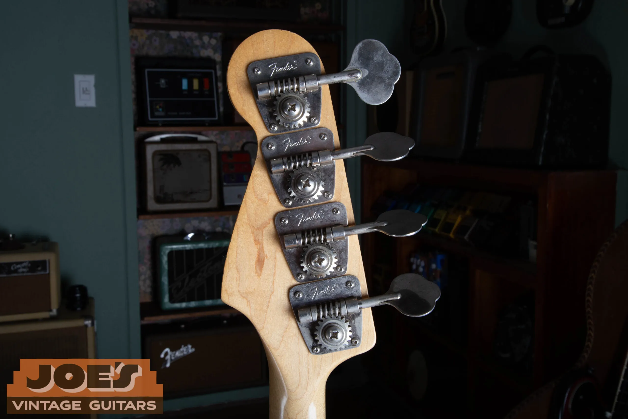 Back of the 1973 Fender Jazz Bass headstock showing the Fender-stamped open-gear tuning machines