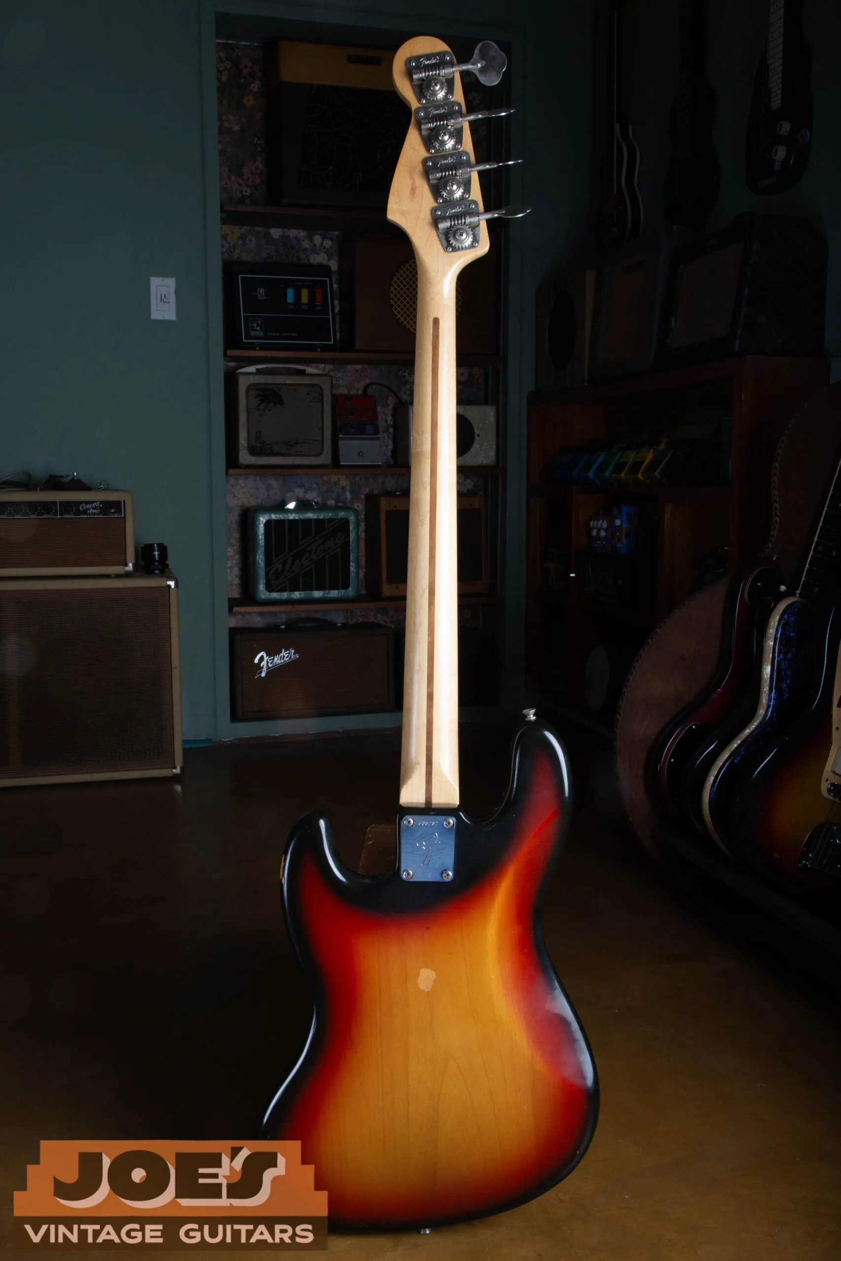 Back view of the 1973 Fender Jazz Bass showing the original 4-bolt neck plate and pristine sunburst finish on the body