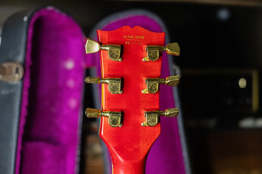 Gold waterslide decal serial number on the back of the headstock of a 1975 Gibson Les Paul Custom, the decal prefix serial number system used on Gibson guitars from 1975 through 1977