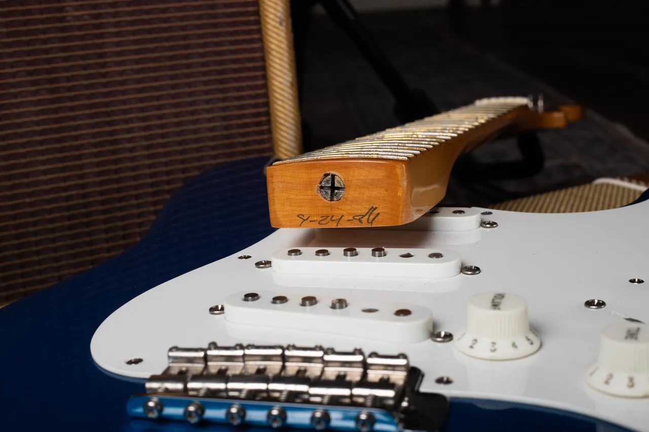 The neck heel of a 1986 Fender American Vintage Reissue Stratocaster with a pencil date reading 4-24-86