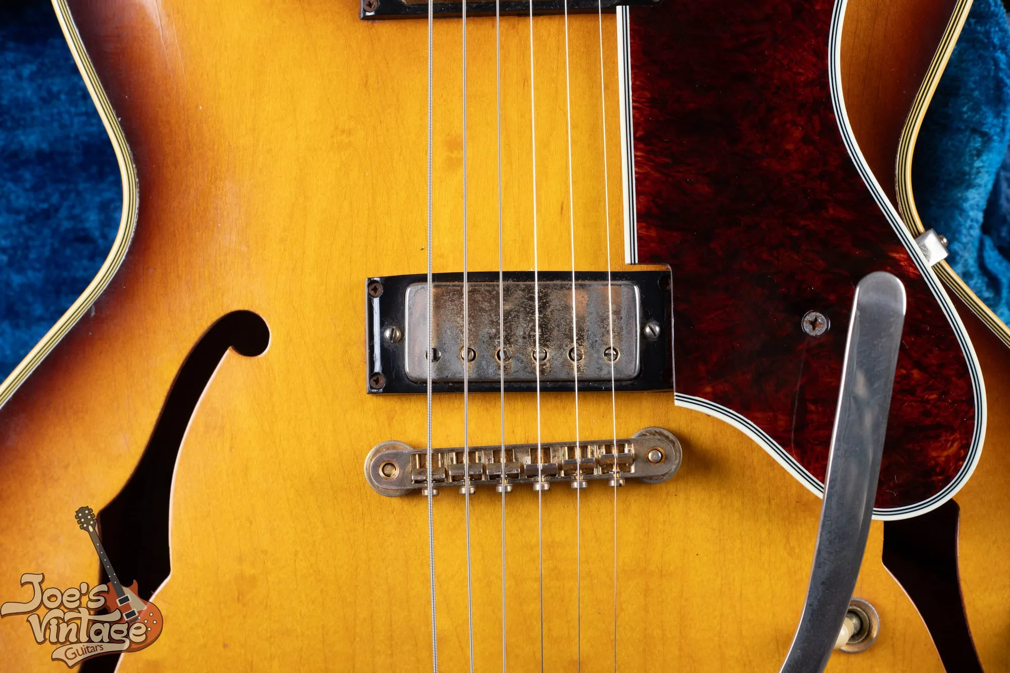 Bridge mini-humbucker and tune-o-matic bridge on a 1961 Epiphone Sheraton in sunburst.