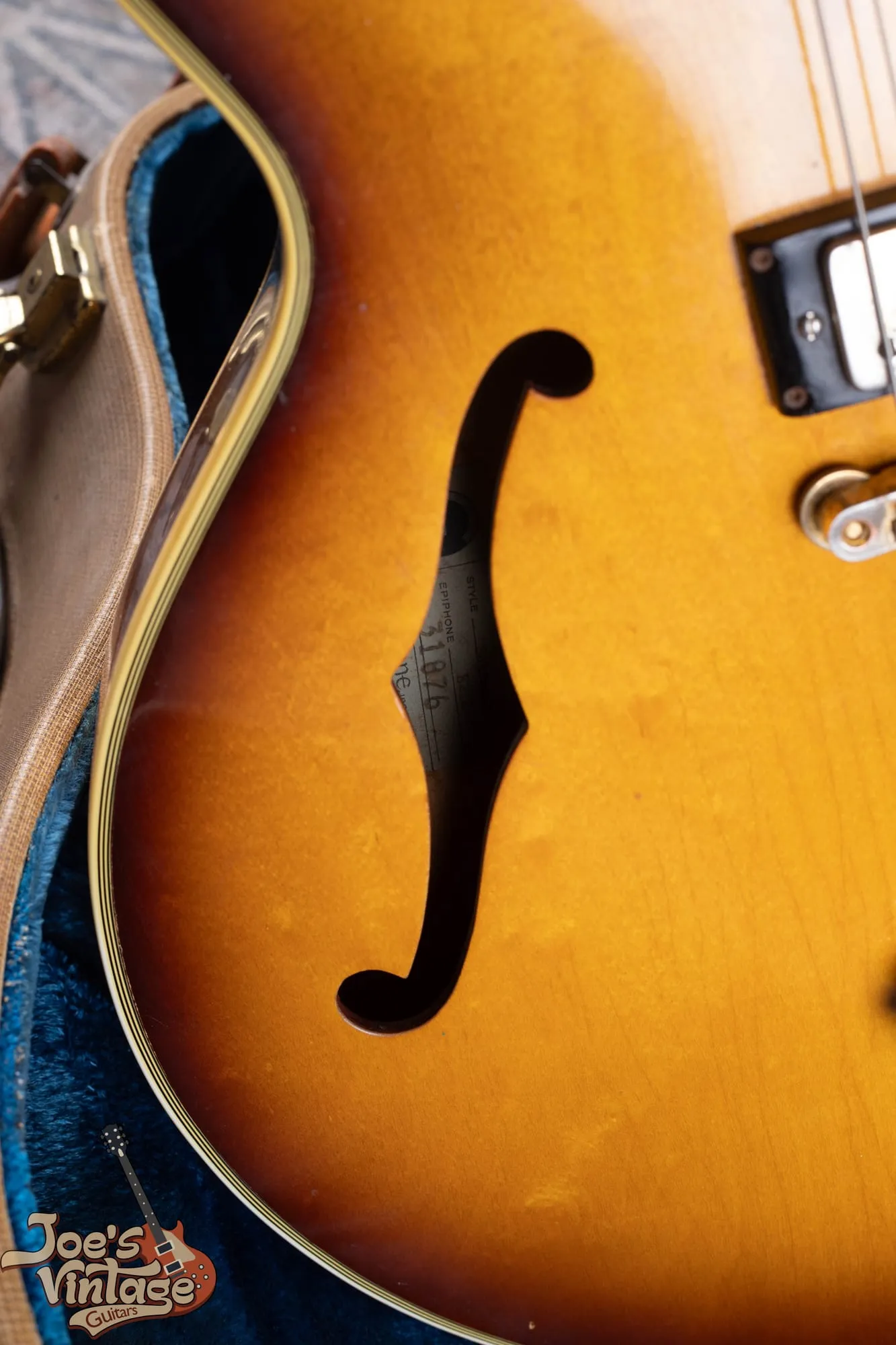 F-hole and bound edge of a vintage Epiphone Sheraton showing the shallow thinline body depth and multi-ply binding.
