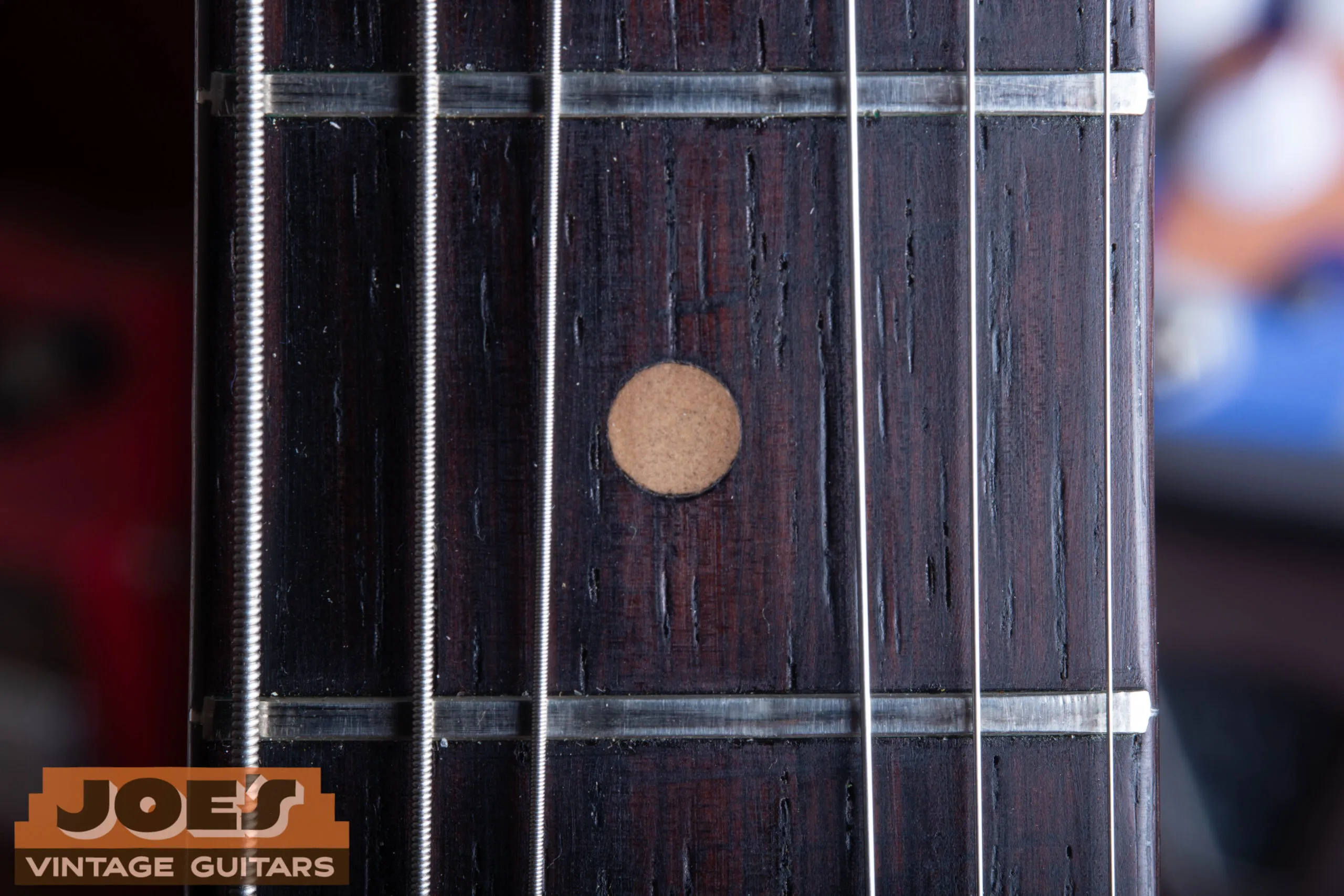 Fender Jazzmaster clay dot fingerboard inlay close-up, light brown matte non-reflective clay dot used 1958 through late 1964, pre-CBS Jazzmaster dating indicator