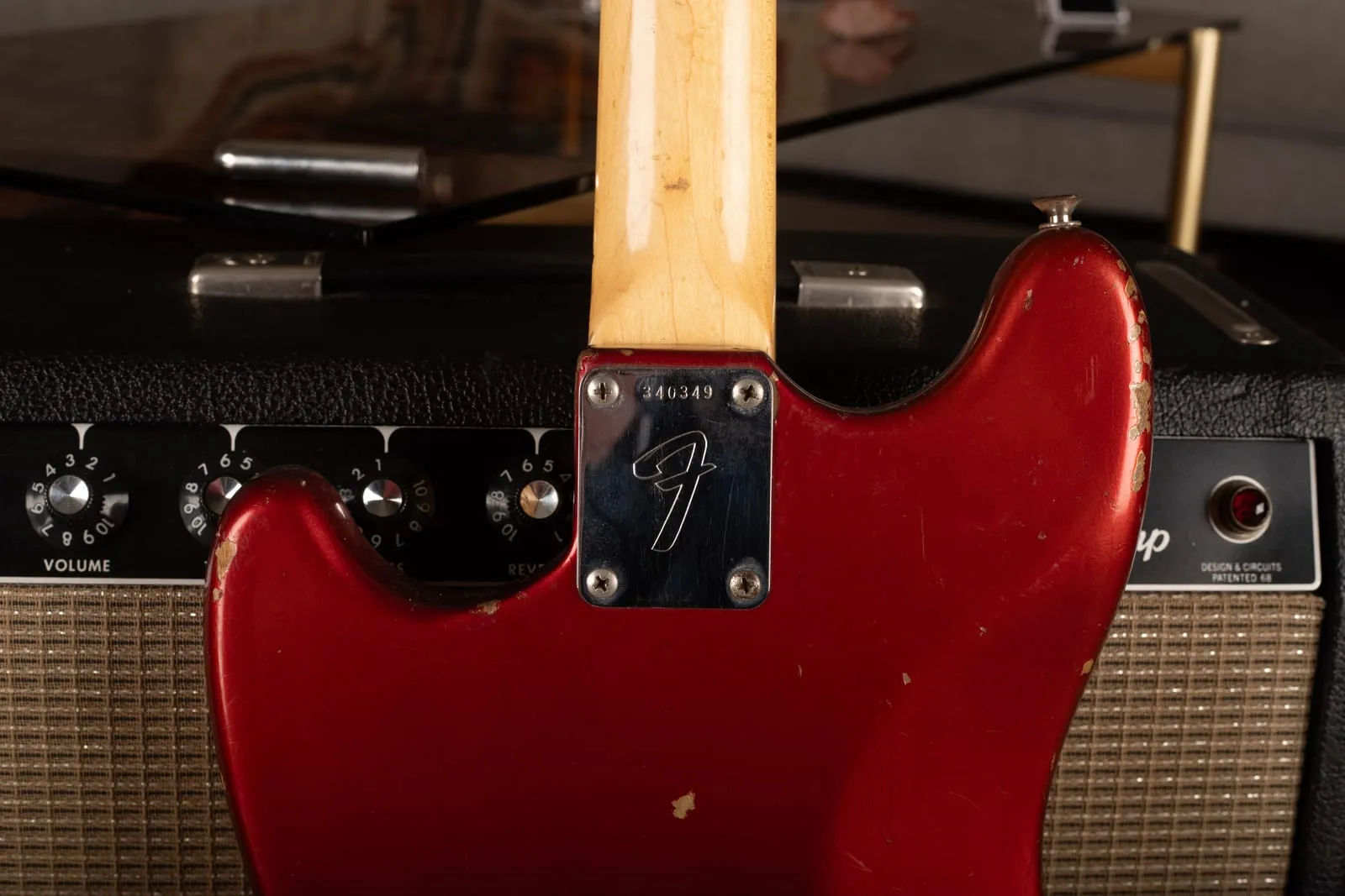 Back of a 1972 Fender Competition Mustang neck showing the F neck plate stamped with serial number 340349.