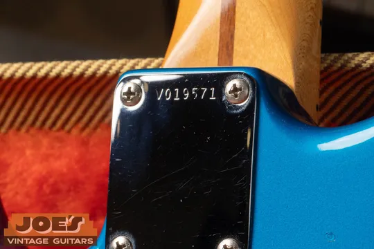 Fender V prefix serial number on the neck plate of a Vintage Reissue guitar