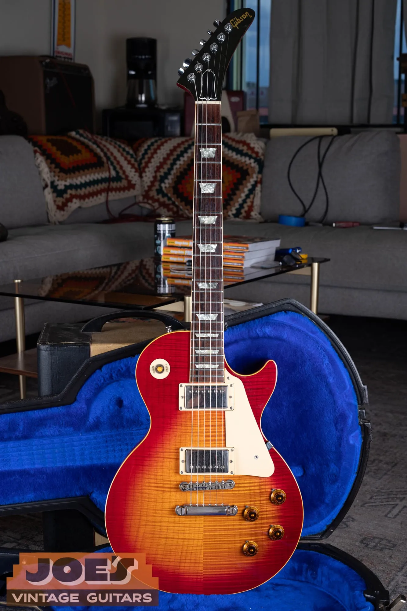 Full front of a 1984 Gibson Aldo Nova Les Paul XPL in cherry sunburst, showing the flamed maple top, two chrome humbuckers, cream pickguard, amber knobs, and the Explorer headstock at the top of the neck.