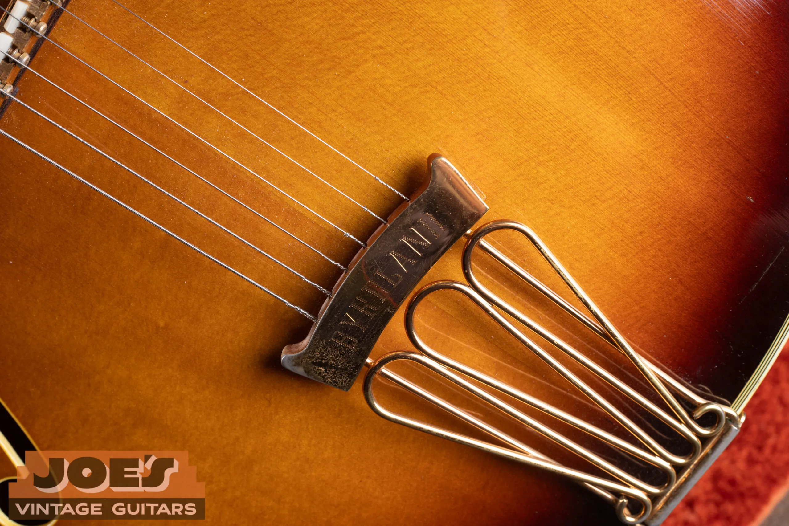 1967 Gibson Byrdland engraved tailpiece, three-loop trapeze style with Byrdland name engraved on crossbar, gold plated