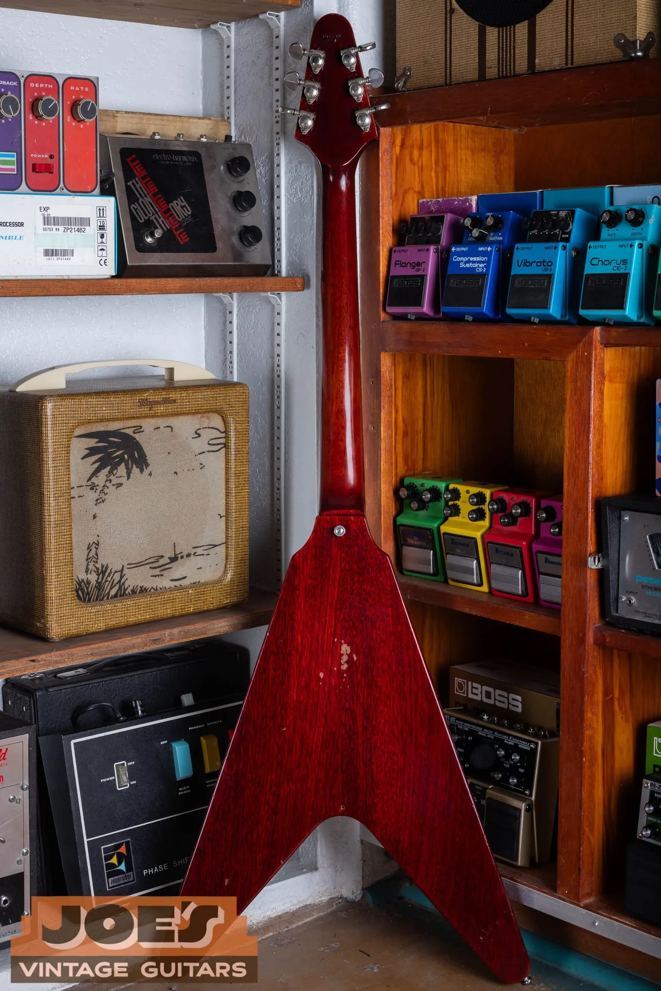 Back of a 1971 Gibson Flying V Medallion in cherry, showing the two-piece mahogany body, the worn-through spot in the finish, and the back of the short headstock.