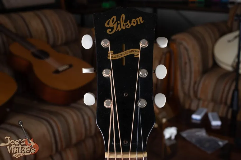 Vintage Gibson wartime headstock showing the Banner logo reading Only a Gibson is Good Enough, an identifier of guitars made between 1942 and 1945