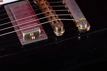 Nashville Tune-O-Matic bridge on a Gibson Firebird, larger than the ABR-1 with threaded metal post inserts