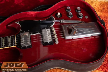 Nickel hardware on a 1962 Gibson SG Standard, with a warm grey-silver tone that ages to a soft yellowish tarnish