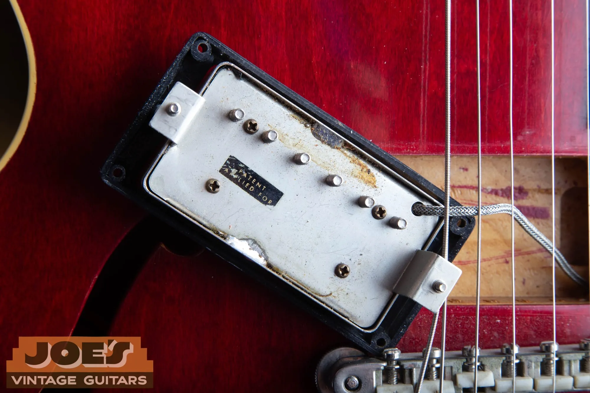 Original Gibson PAF pickup in a 1962 ES-335, flipped over to show the worn Patent Applied For decal on the nickel silver baseplate.