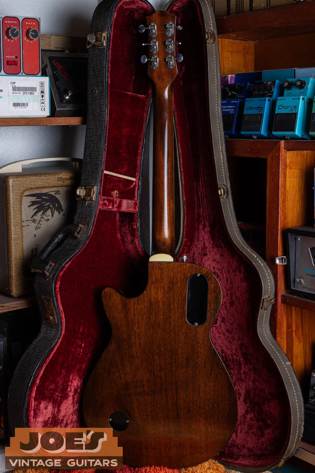 Back of a vintage Gretsch Duo Jet showing the natural mahogany body, single-cutaway shape, and output jack.