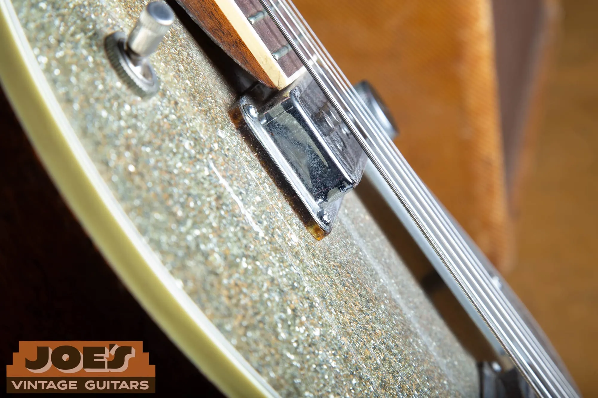 Close view of the multi-ply binding and shallow body depth on the edge of a vintage Gretsch Silver Jet.