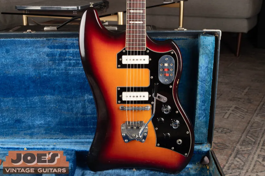 Detailed body shot of a vintage 1960s Guild Thunderbird S-200 electric guitar, showcasing its offset body shape, sunburst finish, and dual-pickup configuration.