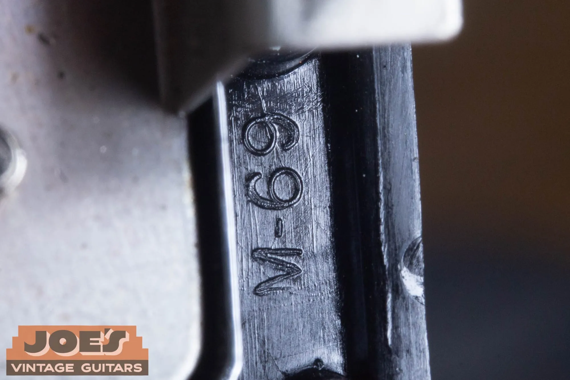 M-69 marking molded into the underside of a vintage Gibson pickup mounting ring.