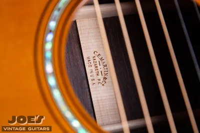 Authentic Martin back center strip stamped C.F. Martin & Co. Nazareth, PA., seen through the soundhole