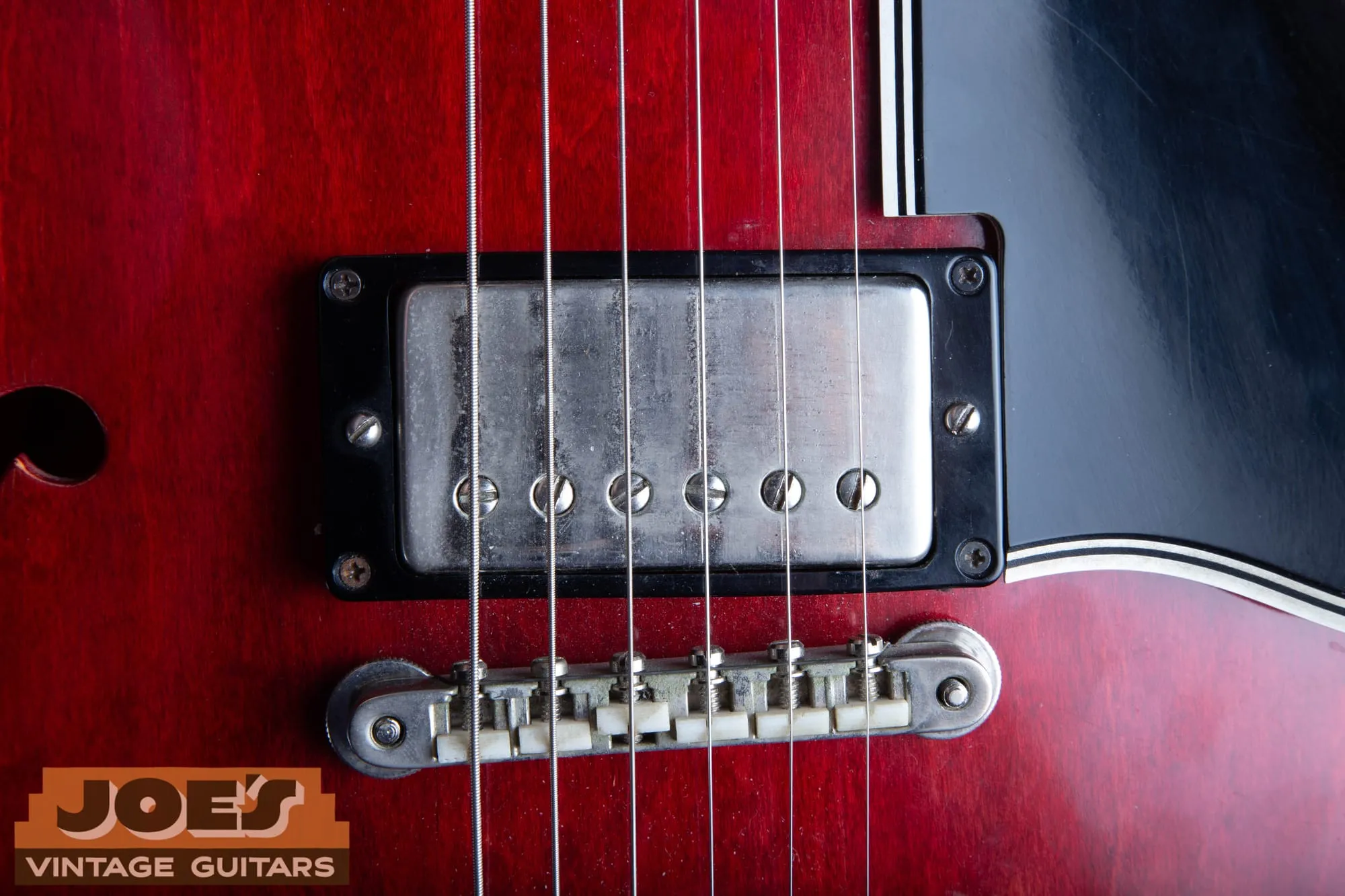 Nickel covered patent era humbucker mounted in a cherry 1962 Gibson ES-335 with a tune-o-matic bridge.